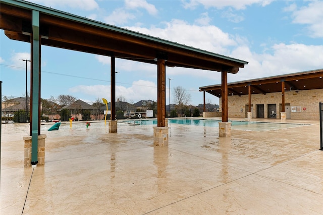 view of patio featuring a community pool