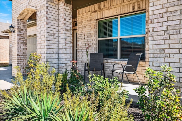 view of patio featuring driveway and a garage