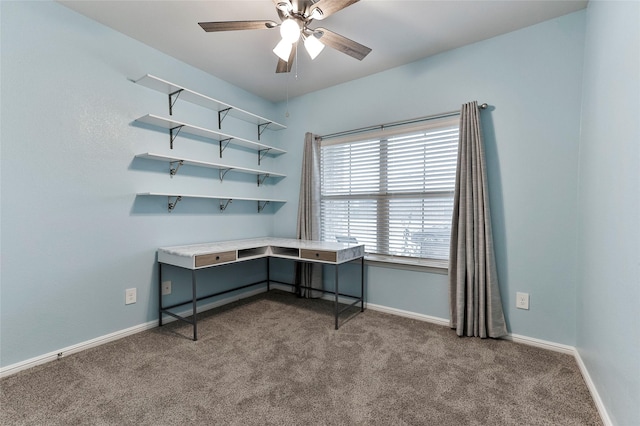 carpeted home office featuring ceiling fan