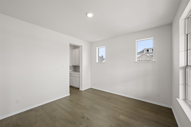 371 Freestall Dr, Midlothian, TX 76065 - empty room with dark wood-style floors, plenty of natural light, baseboards, and recessed lighting
