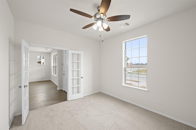 371 Freestall Dr, Midlothian, TX 76065 - unfurnished bedroom with french doors, multiple windows, carpet, and baseboards