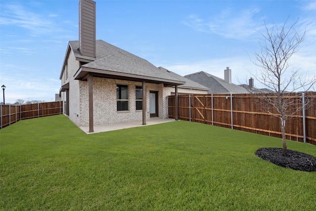 371 Freestall Dr, Midlothian, TX 76065 - back of property with a chimney, a patio, brick siding, and roof with shingles