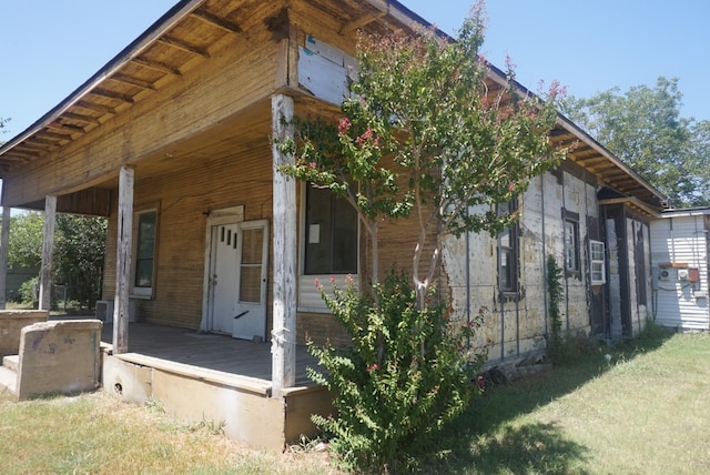 view of side of property with a porch