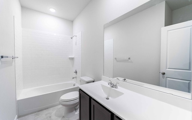 bathroom with tub / shower combination, vanity, and toilet