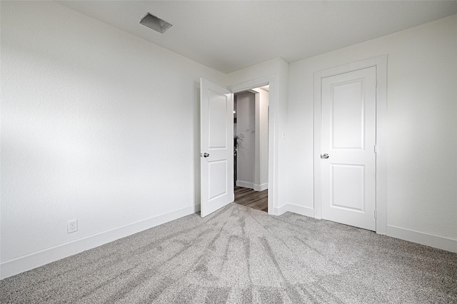 unfurnished bedroom featuring carpet