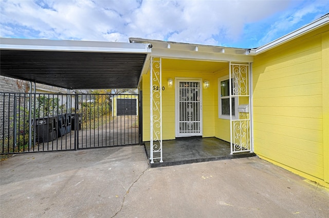 doorway to property featuring a carport