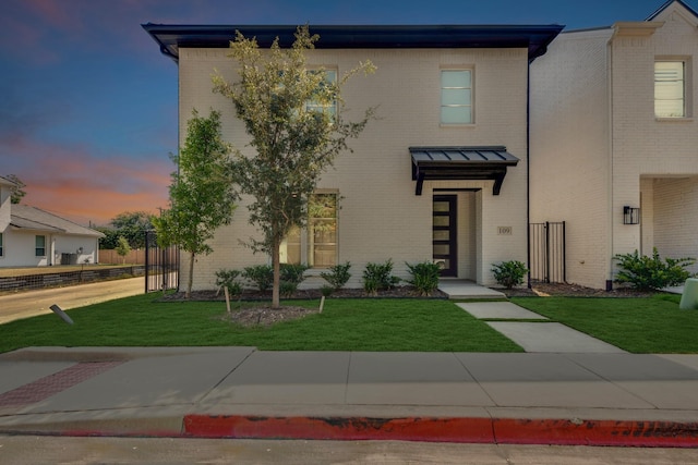 view of front of house with a yard