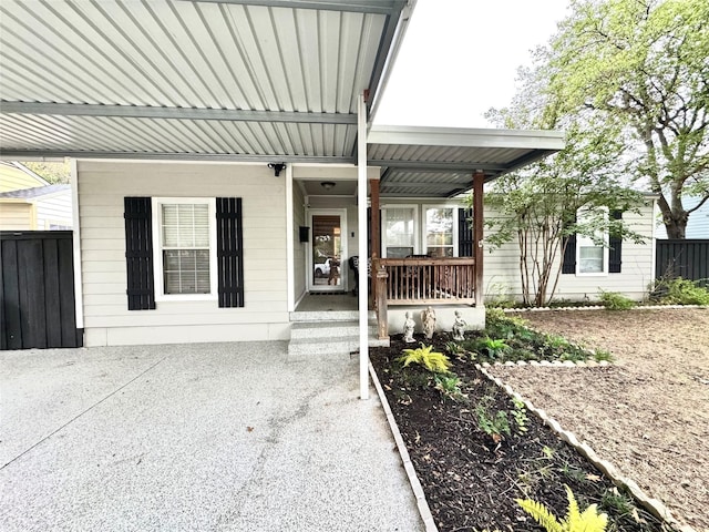 view of exterior entry featuring a porch