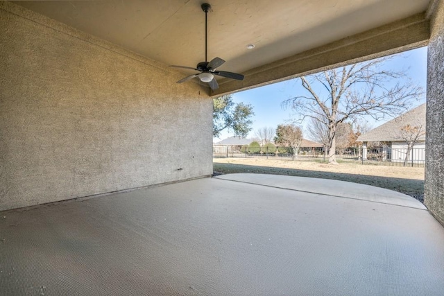 view of patio / terrace featuring ceiling fan and fence