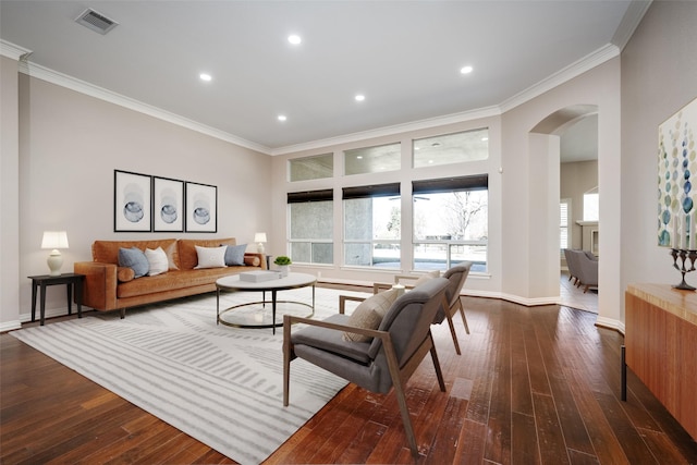 living room with ornamental molding and dark hardwood / wood-style flooring