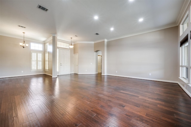 unfurnished living room featuring dark wood-style floors, visible vents, and ornamental molding