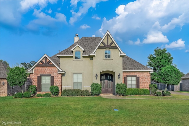 view of front of property with a front lawn