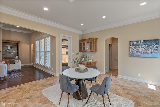 dining space with crown molding