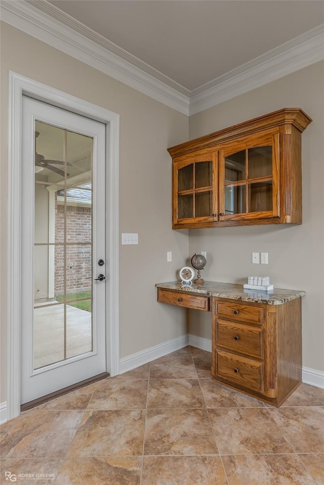 interior space with ornamental molding and light stone countertops