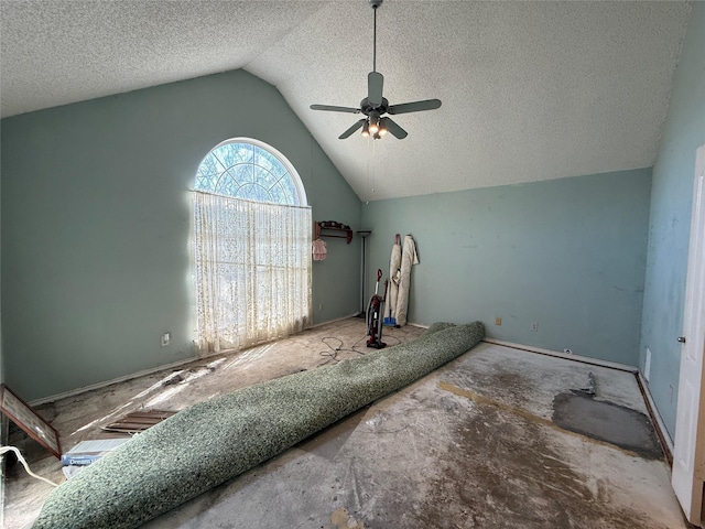 unfurnished bedroom featuring lofted ceiling, ceiling fan, and a textured ceiling