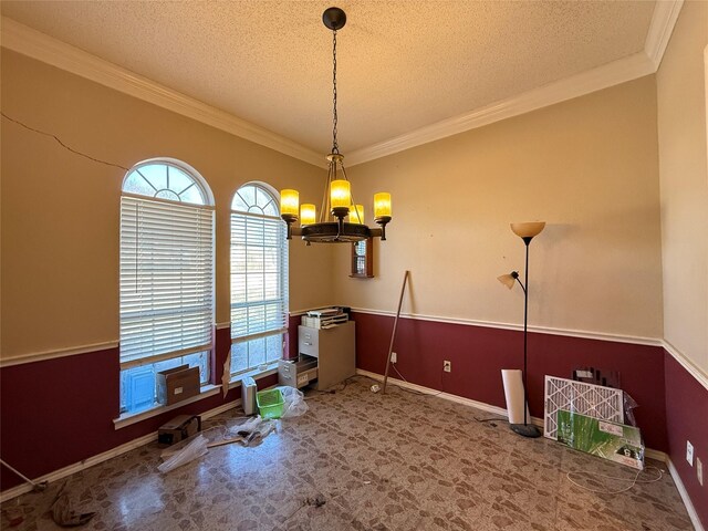 living room with crown molding, ceiling fan, wood-type flooring, a textured ceiling, and a brick fireplace