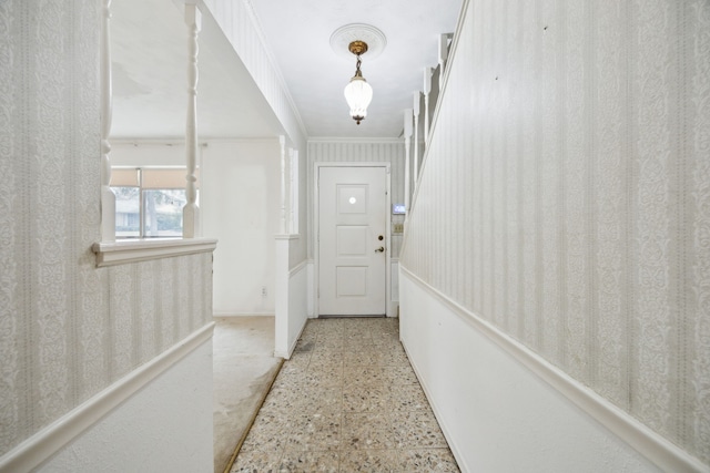 hallway featuring ornamental molding