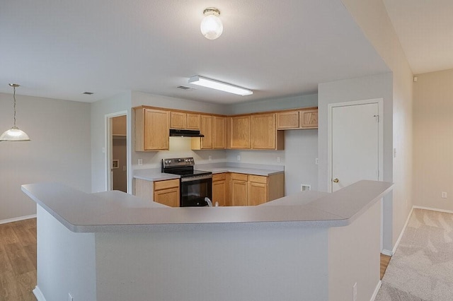 1013 Caleb St, Burleson, TX 76028 - kitchen with electric stove, under cabinet range hood, light countertops, a large island with sink, and decorative light fixtures