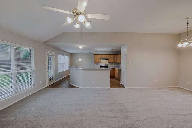 1013 Caleb St, Burleson, TX 76028 - kitchen featuring black / electric stove, ceiling fan, brown cabinets, lofted ceiling, and carpet floors