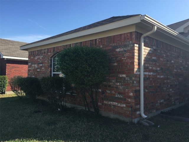 view of home's exterior with a yard