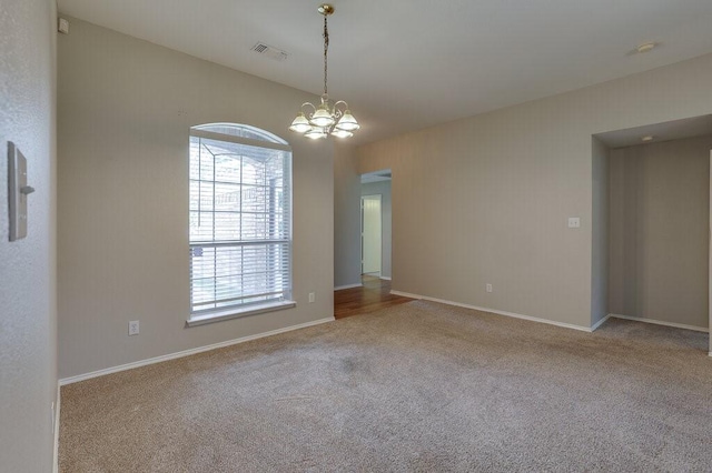 1013 Caleb St, Burleson, TX 76028 - unfurnished room featuring a chandelier, plenty of natural light, and carpet floors