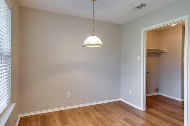 1013 Caleb St, Burleson, TX 76028 - unfurnished dining area featuring light wood finished floors and baseboards