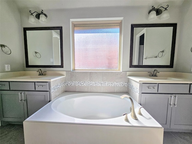 bathroom with vanity and a washtub