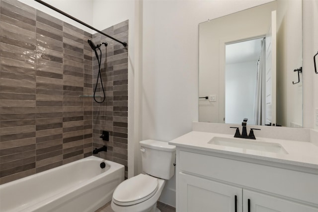 full bathroom featuring vanity, toilet, and tiled shower / bath