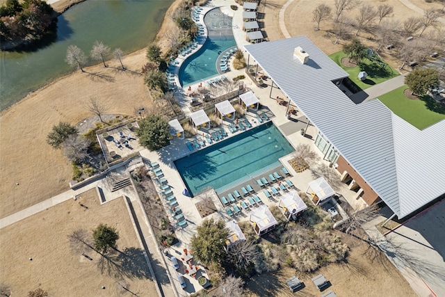 birds eye view of property with a water view