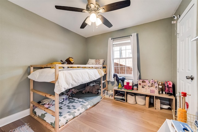 bedroom with ceiling fan and wood-type flooring