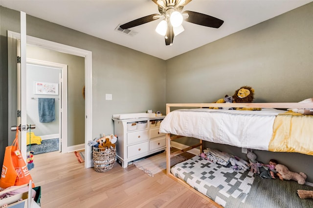 bedroom with ceiling fan and light hardwood / wood-style floors