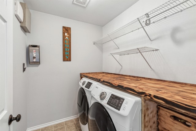 washroom with independent washer and dryer