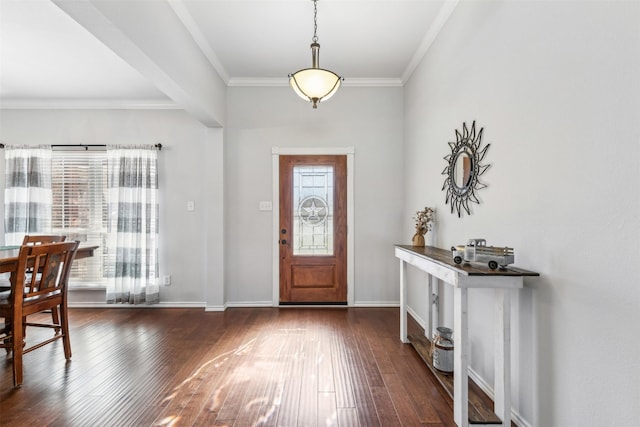 foyer entrance with crown molding, plenty of natural light, and dark wood-type flooring