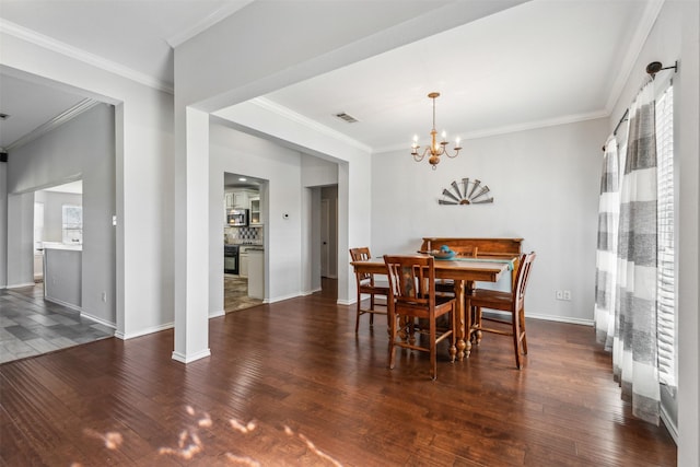 dining area with crown molding, dark hardwood / wood-style flooring, and a wealth of natural light