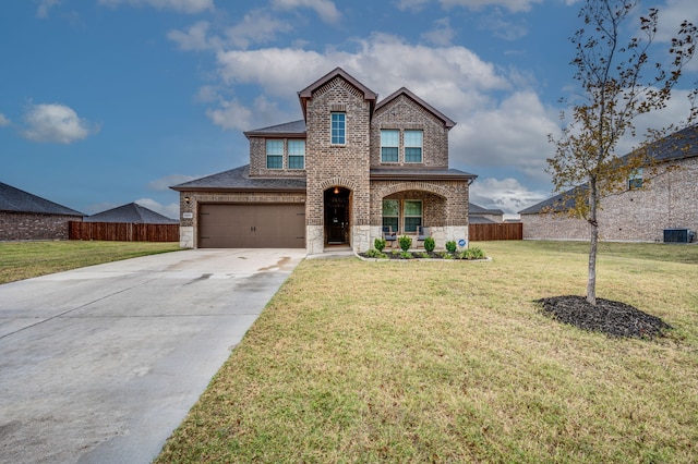 view of front of house featuring a garage, a front yard, and cooling unit