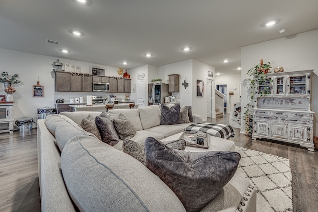 living room featuring dark wood-type flooring