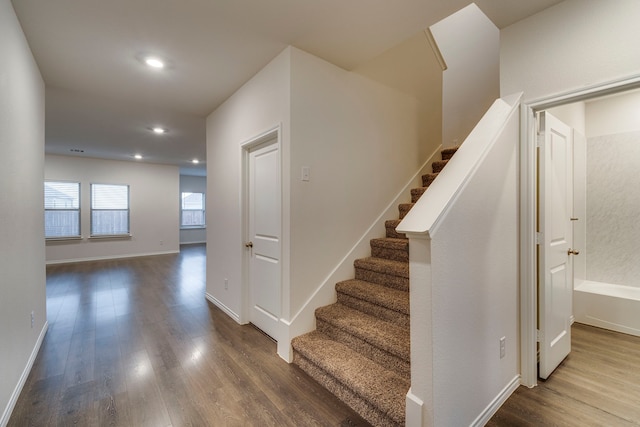 stairs with wood-type flooring