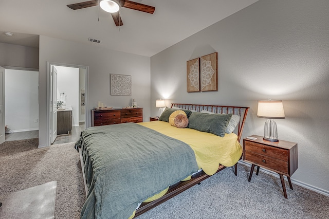 carpeted bedroom featuring ceiling fan and connected bathroom