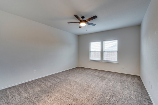 empty room with carpet floors and ceiling fan