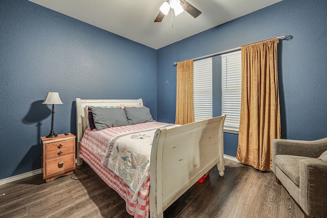 bedroom featuring dark wood-type flooring and ceiling fan