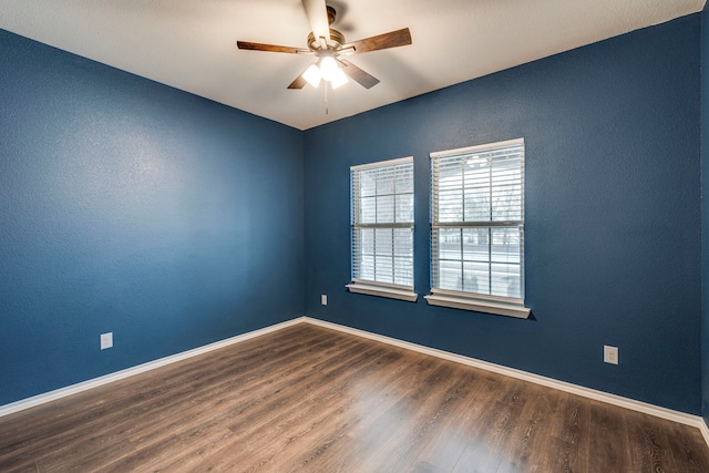 spare room featuring ceiling fan and wood-type flooring