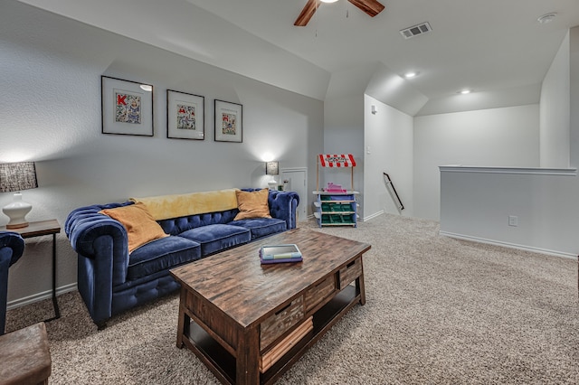 carpeted living room featuring vaulted ceiling and ceiling fan