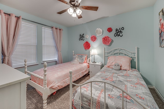 bedroom with ceiling fan and carpet flooring