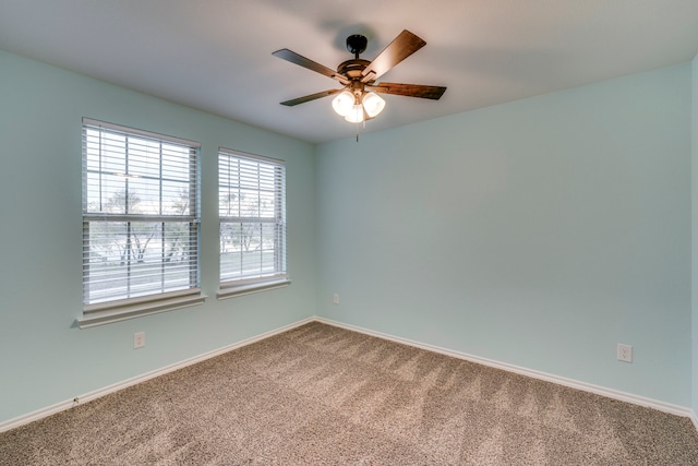 carpeted empty room with ceiling fan