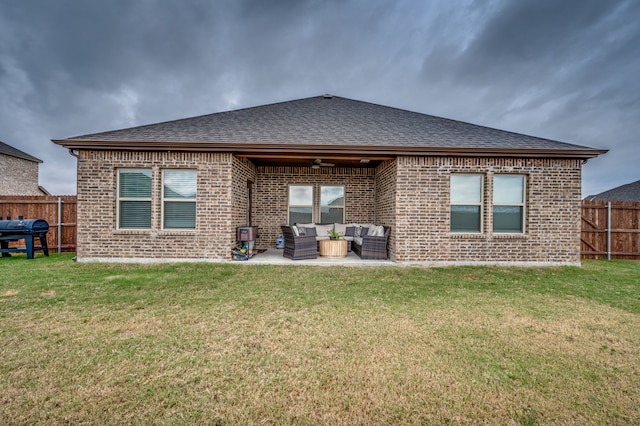 back of house with a lawn, outdoor lounge area, a patio, and ceiling fan