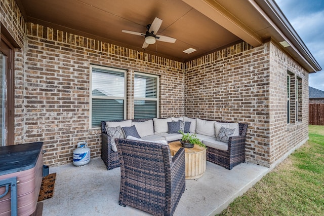 view of patio with an outdoor living space and ceiling fan