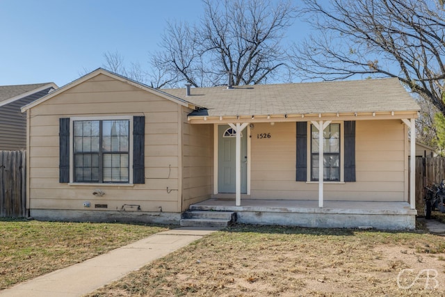 view of front of property with a porch and a front yard