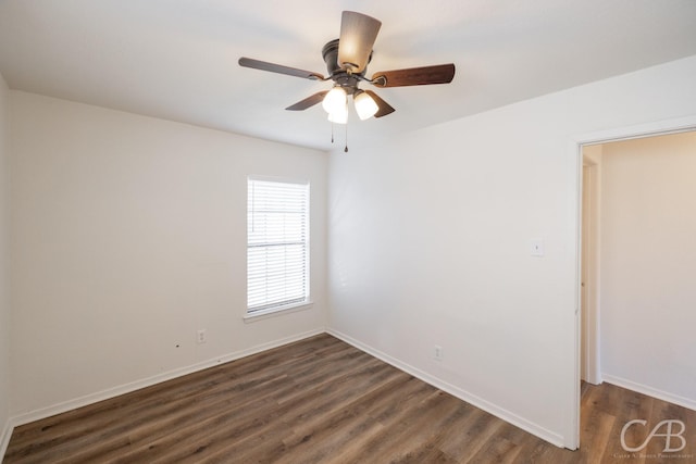 unfurnished room featuring ceiling fan and dark hardwood / wood-style flooring