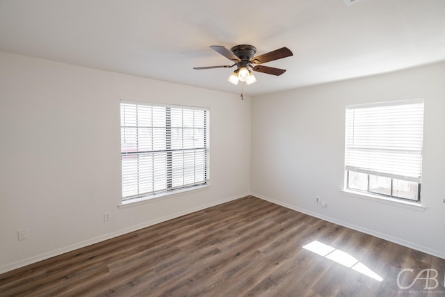 unfurnished room featuring dark hardwood / wood-style floors and ceiling fan