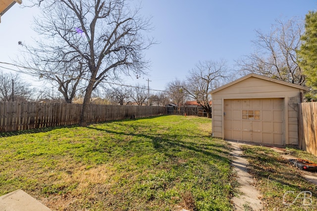 view of yard featuring a garage and an outdoor structure